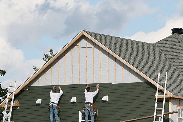 Professional Siding technician working in Montgomery Village, MD